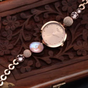 titan raga women's charm: elegant mother of pearl dial with ornate strap watch